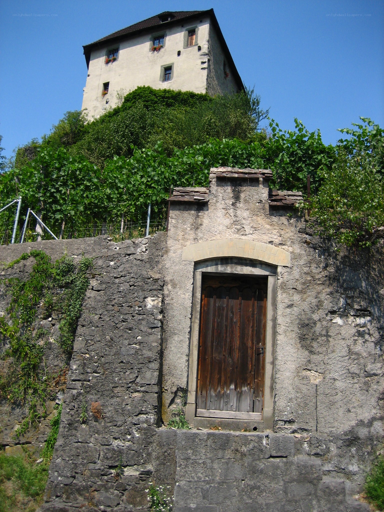 Old stone building with wooden door
