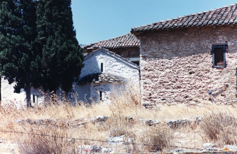 Old stone buildings in a dry landscape