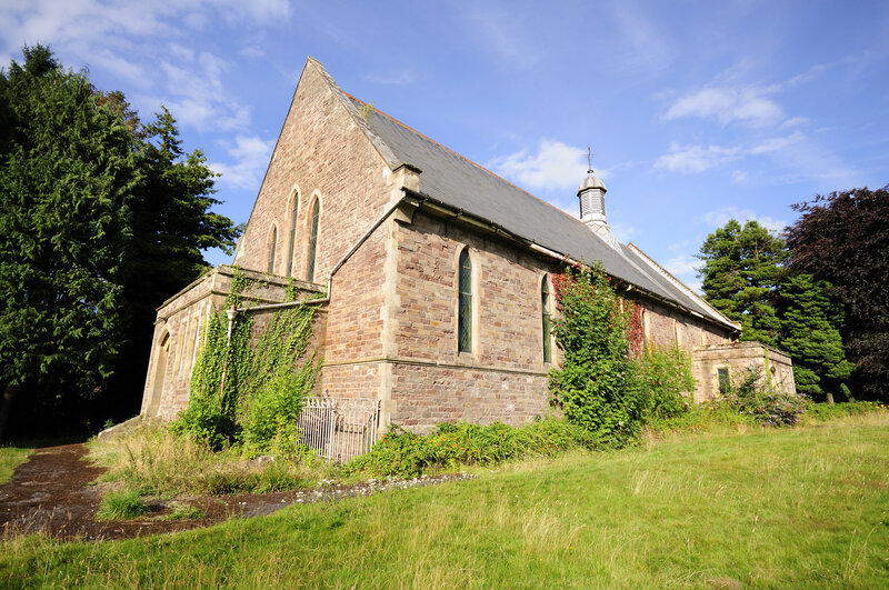 Old stone church in a grassy field
