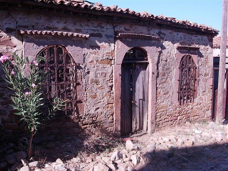 Old stone house with arched windows