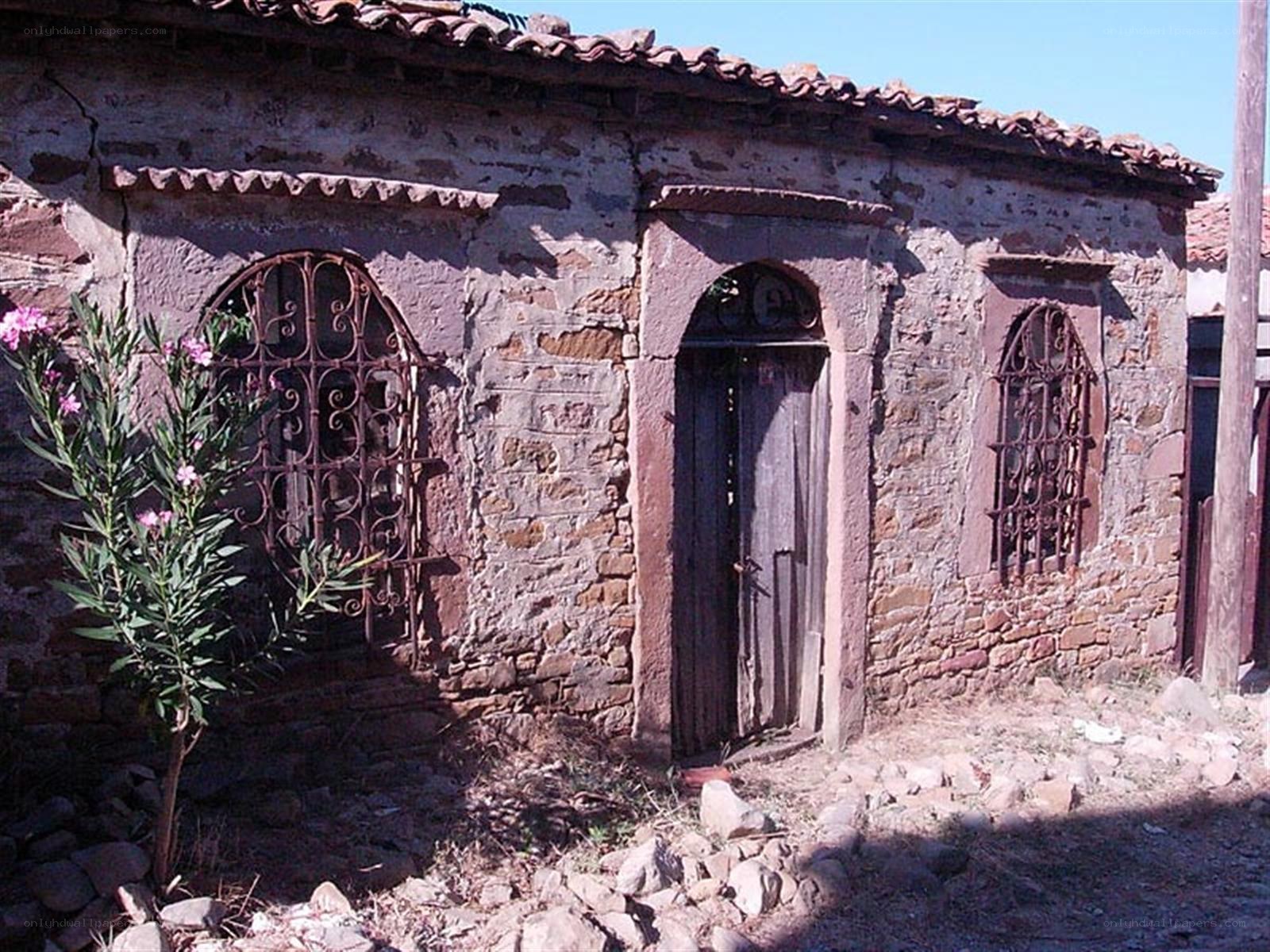Old stone house with arched windows