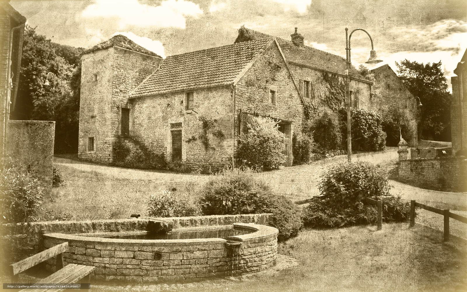 Old stone house with well
