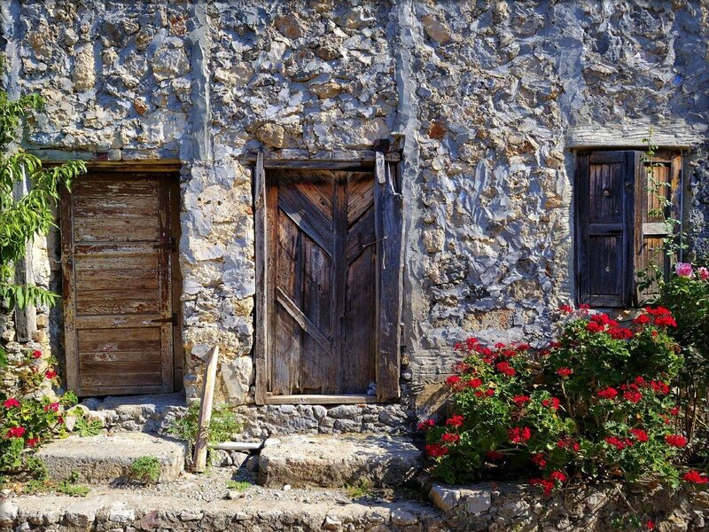 Old stone house with wooden doors