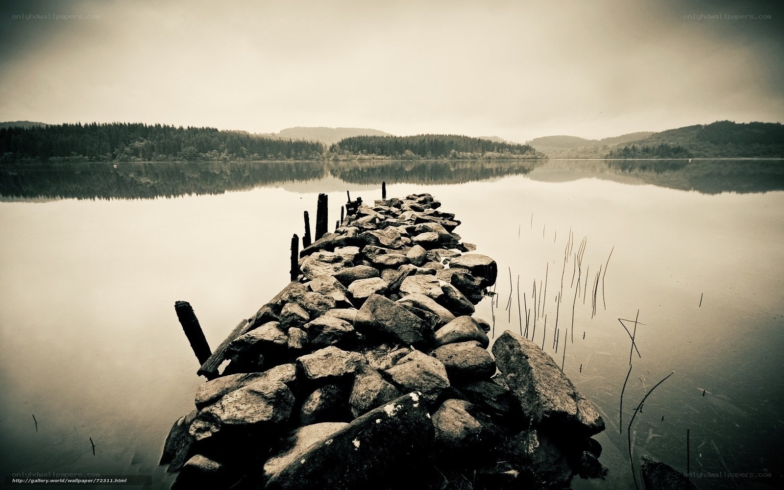 Old stone pier on a calm lake
