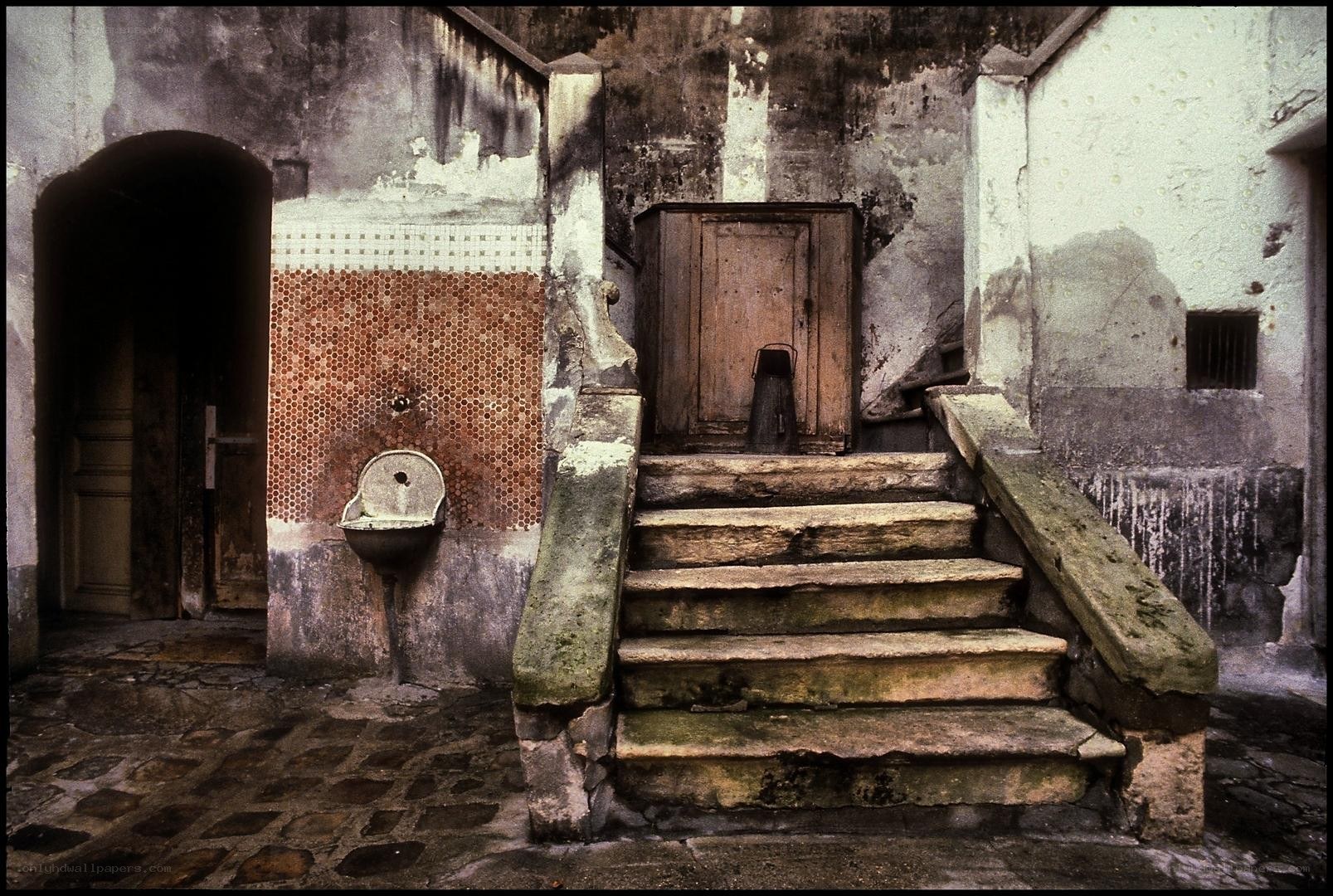 Old stone staircase in courtyard