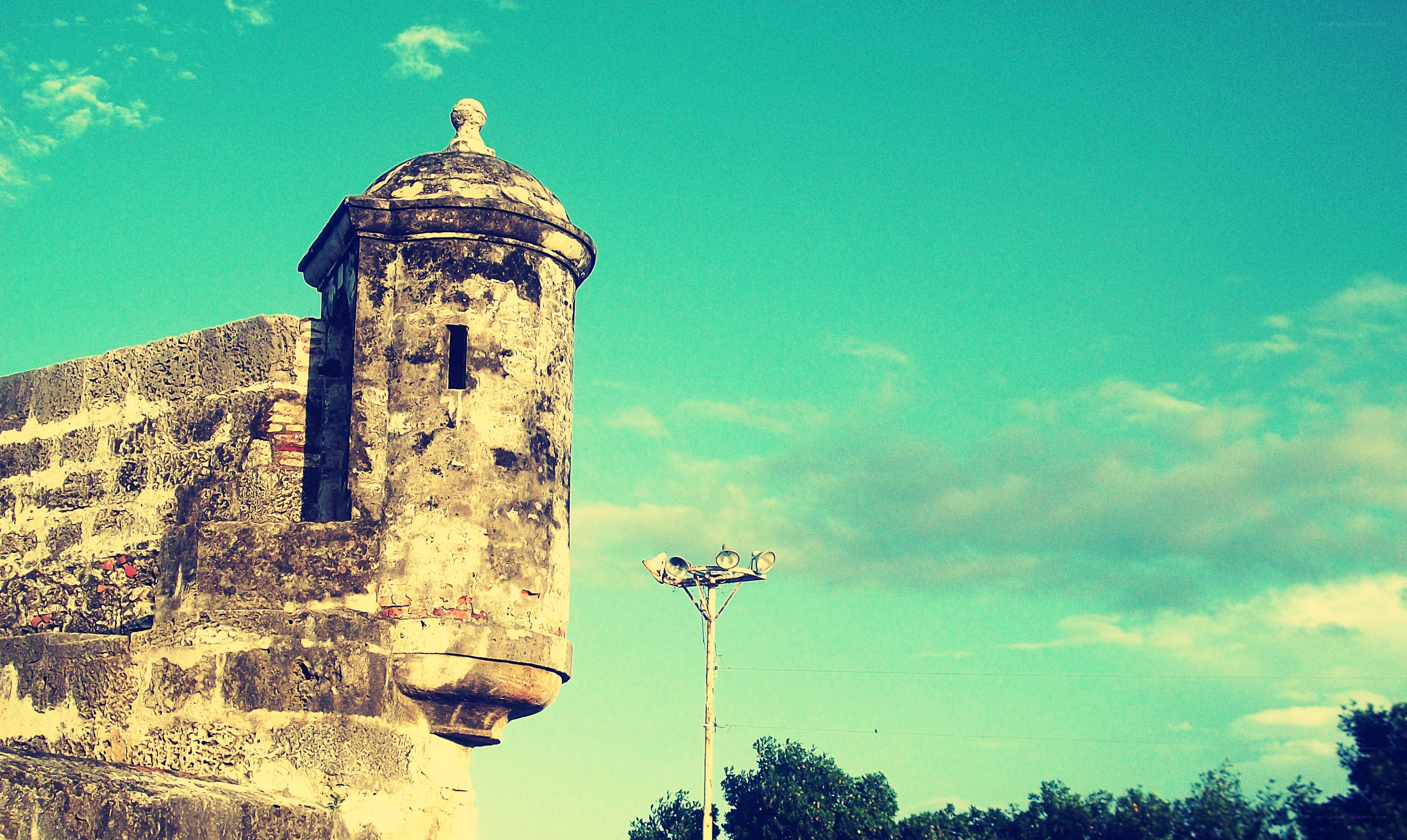 Old stone tower against blue sky