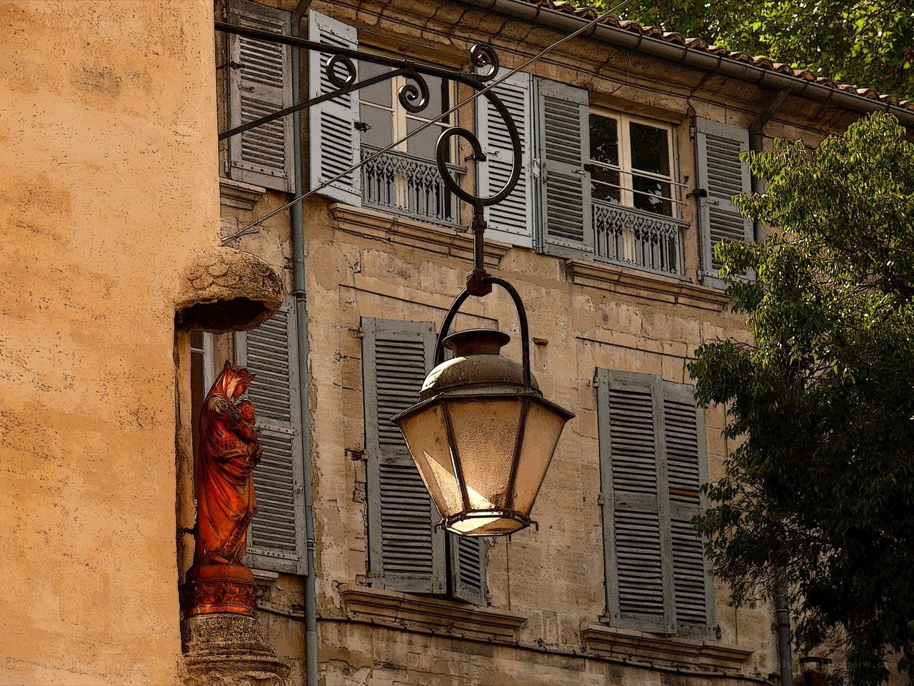 Old street lamp and statue