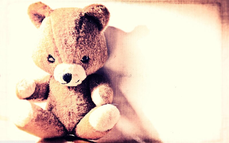 old teddy bear with faded look