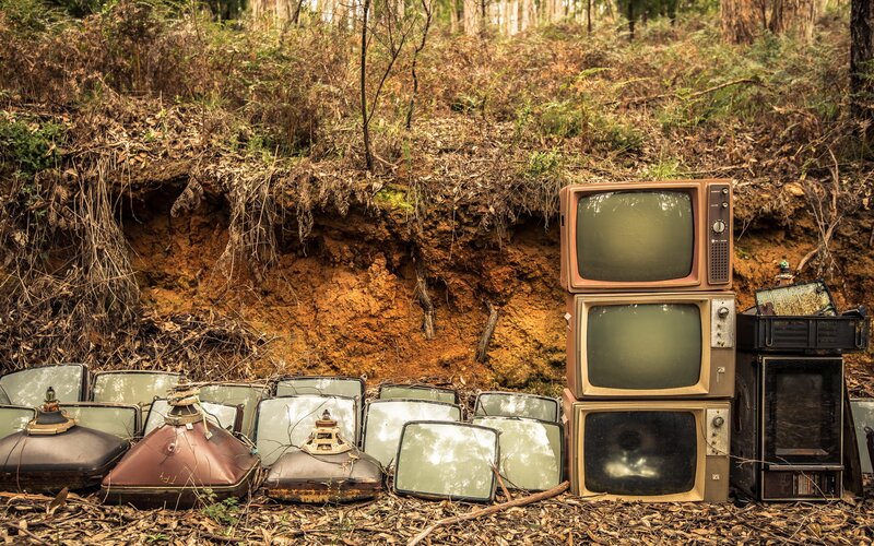 Old Televisions in Forest