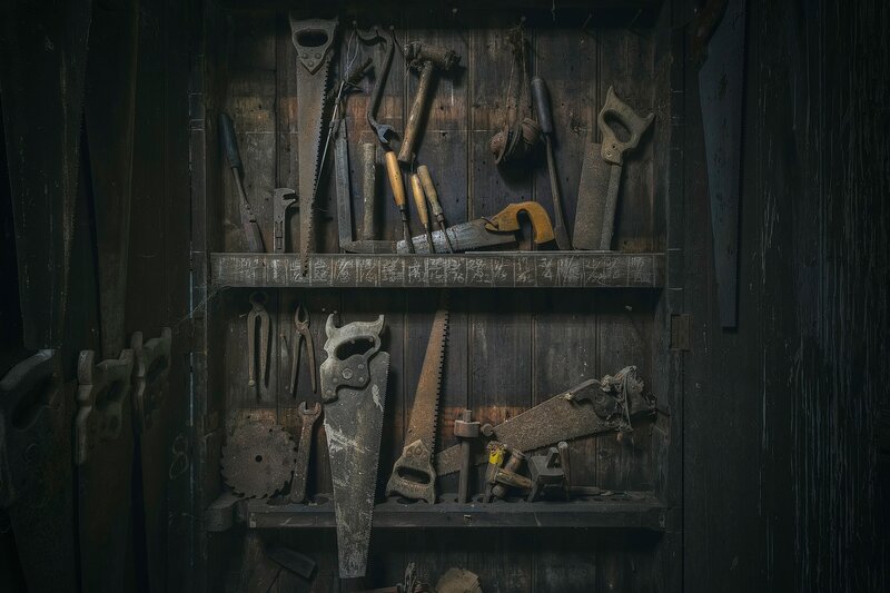 Old Tools in Wooden Cabinet