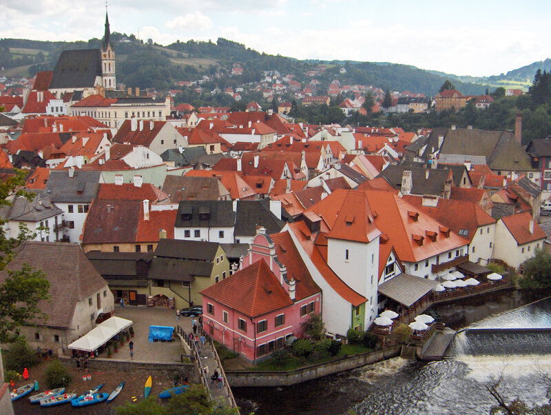 Old town with red roofs and river