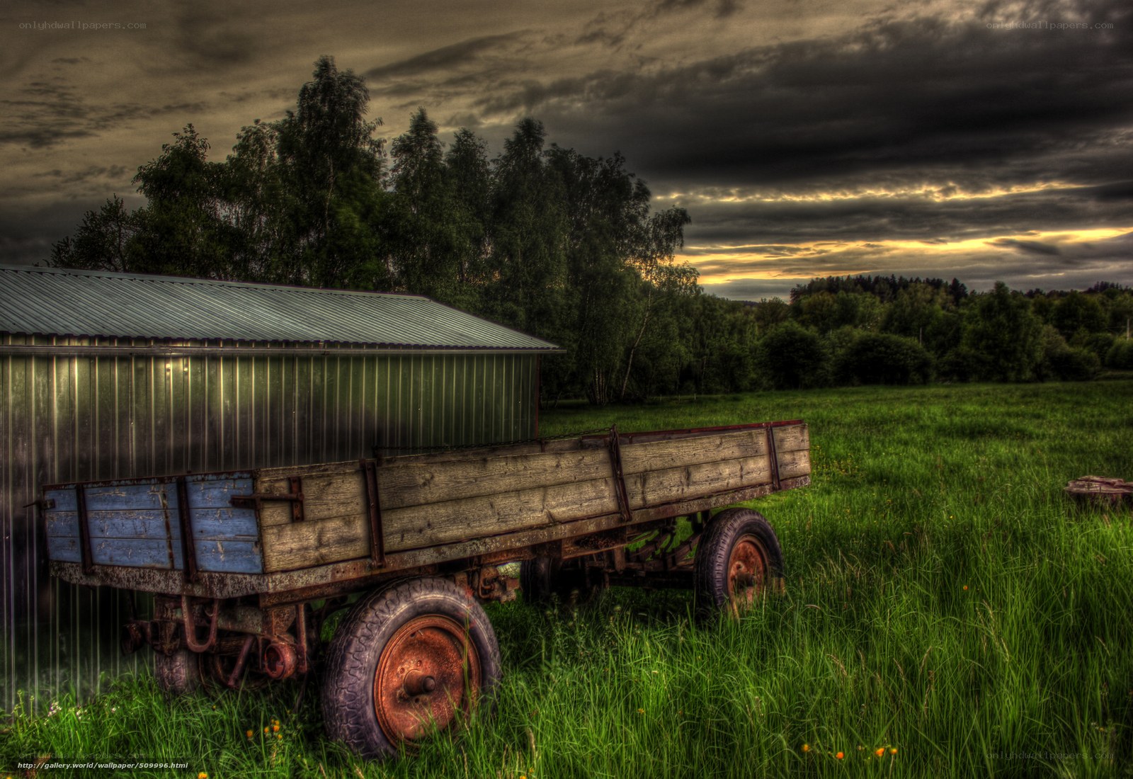 Old trailer in a green field