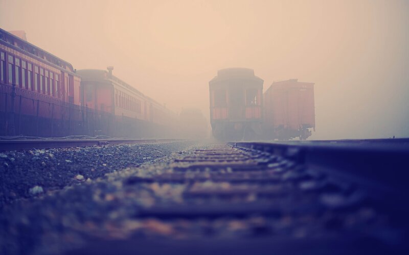 Old Train Cars on Tracks