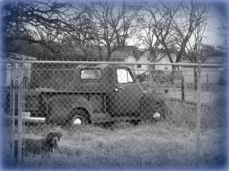 Old Truck Behind Fence