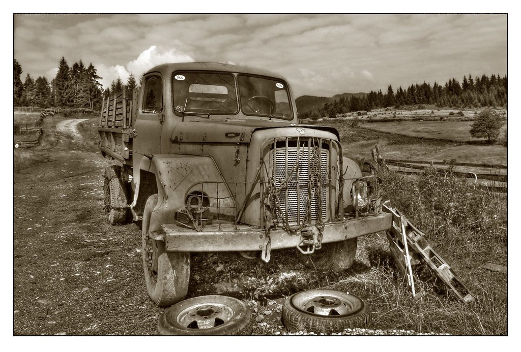 Old truck in rural landscape