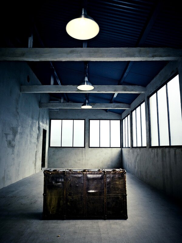 Old trunk in an empty warehouse