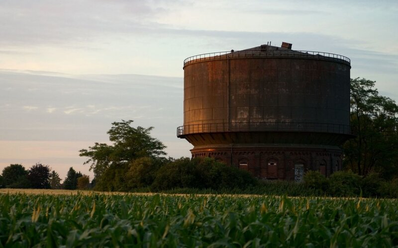 Old water tower in a cornfield