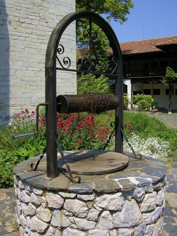 Old well in garden courtyard