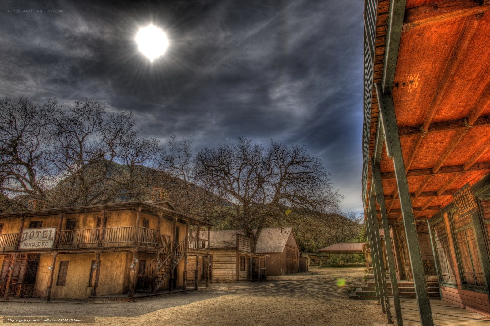 Old Western town under moonlight