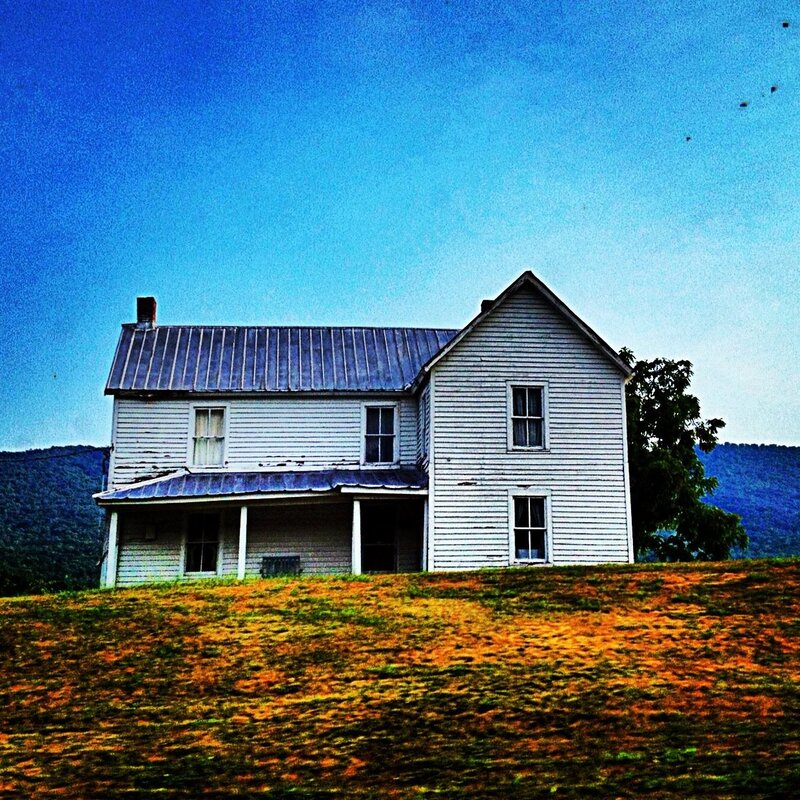 old white house on a hill