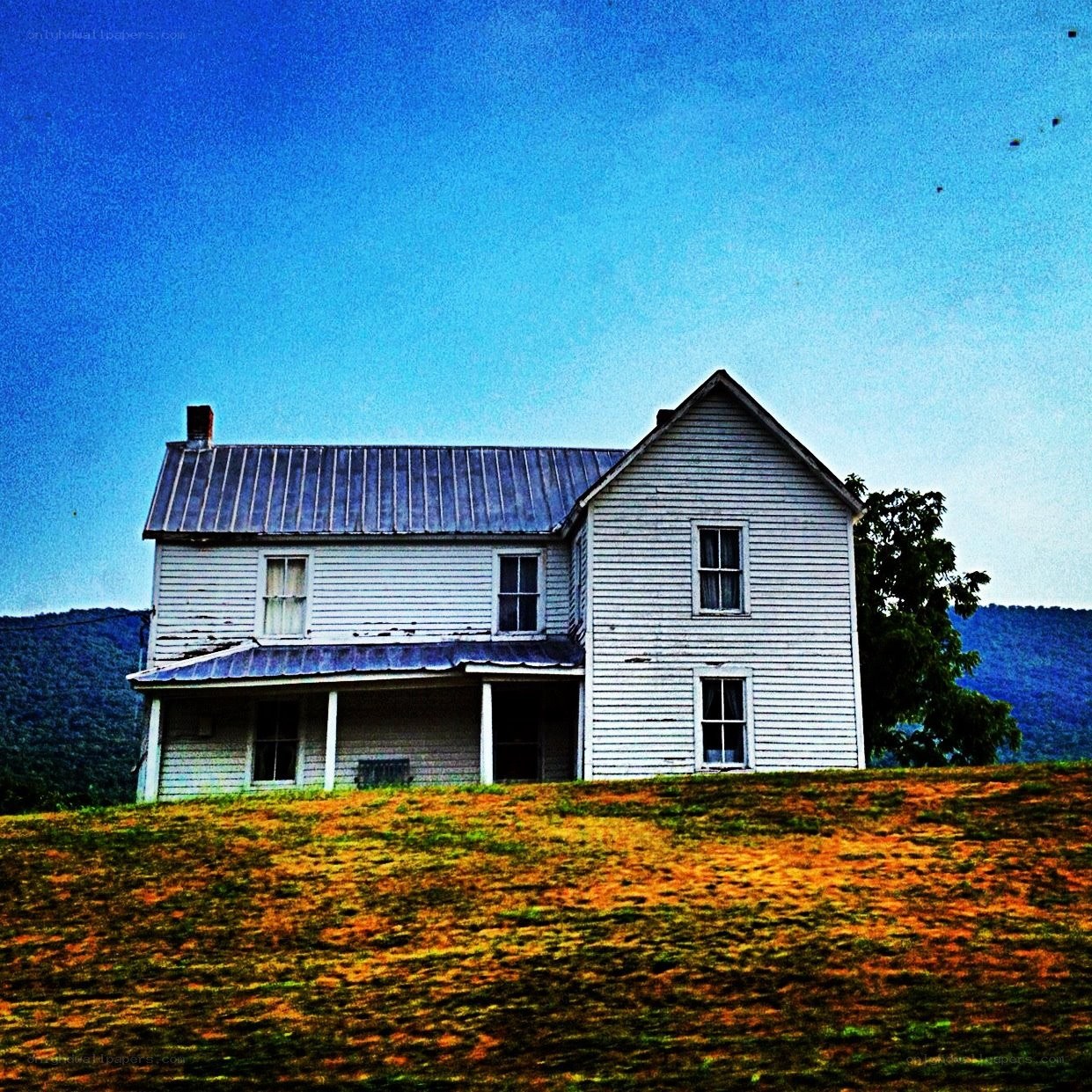 old white house on a hill