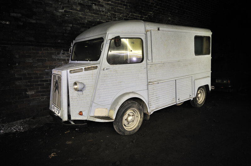 Old white van in dark alley