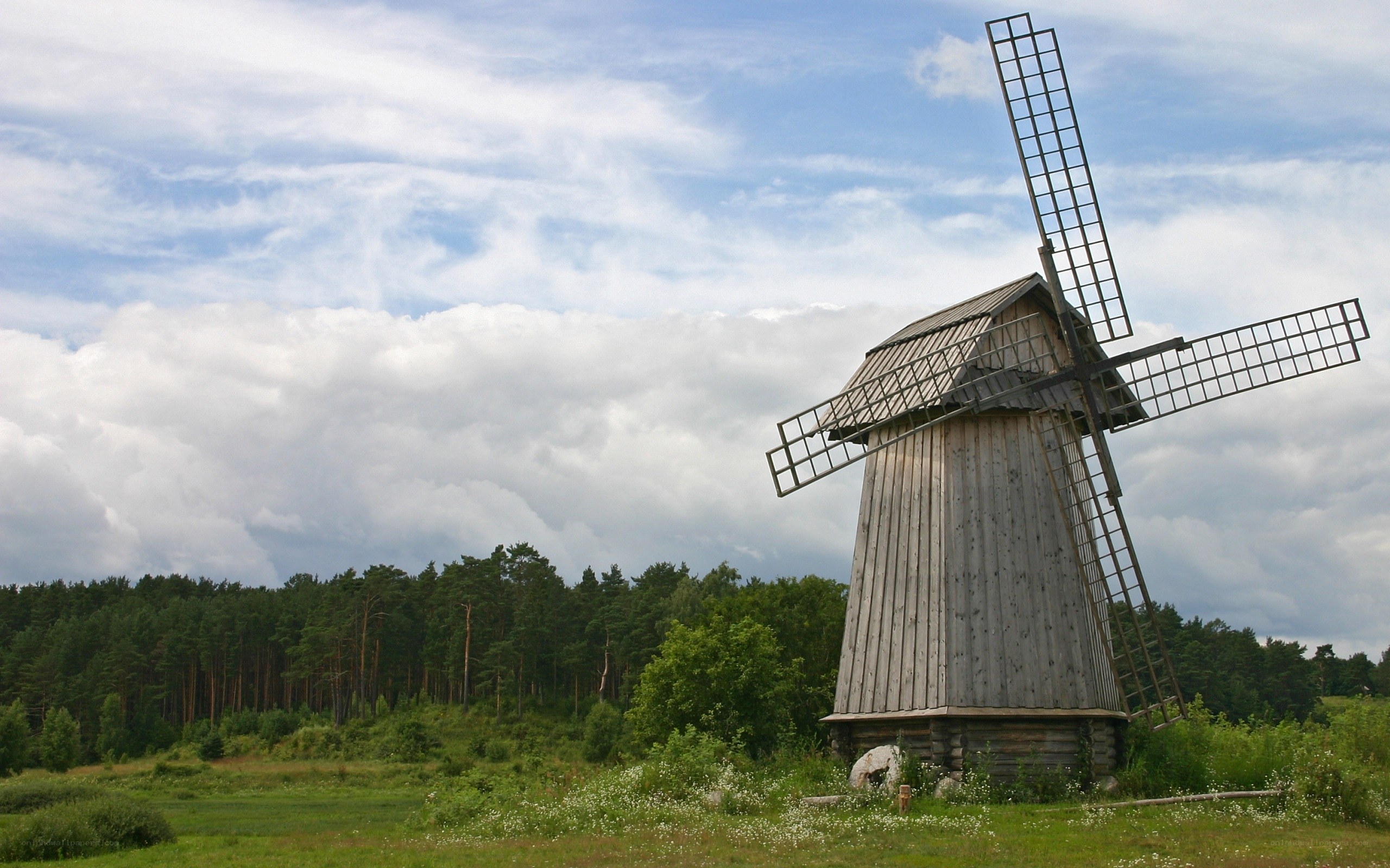 Old windmill in a green field