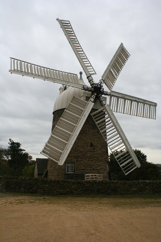 Old windmill with white sails