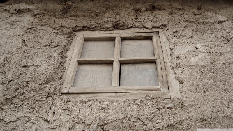 old window in mud wall