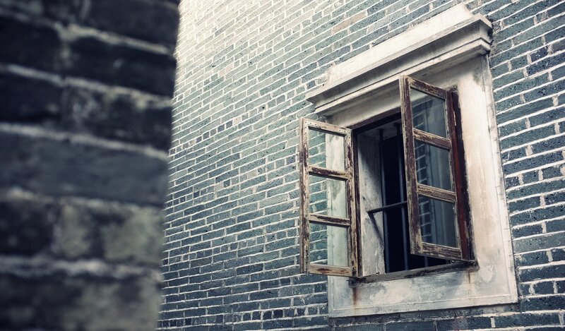 old window on brick wall