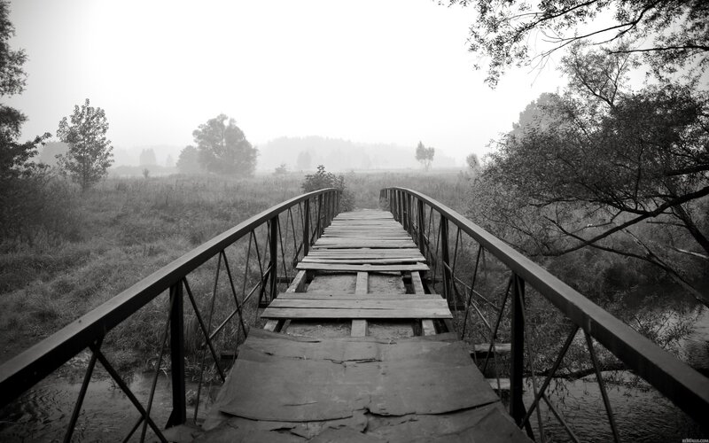 Old wooden bridge in fog