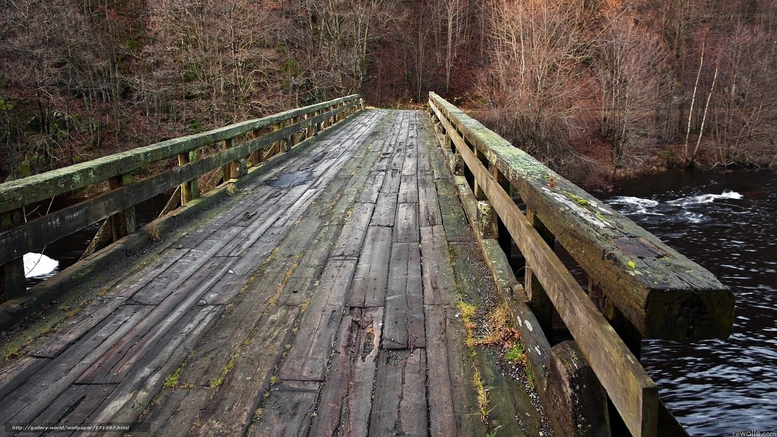Old wooden bridge over river