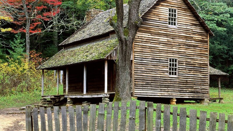 Old wooden cabin in autumn forest