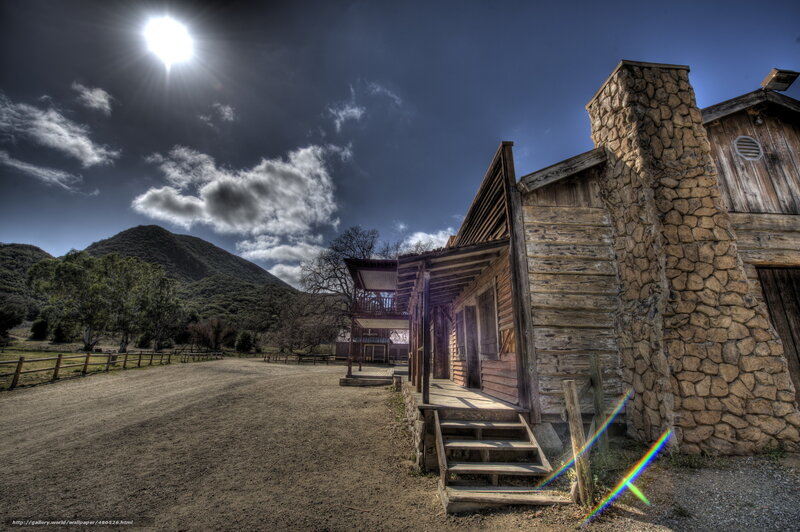 Old wooden cabin in mountain valley