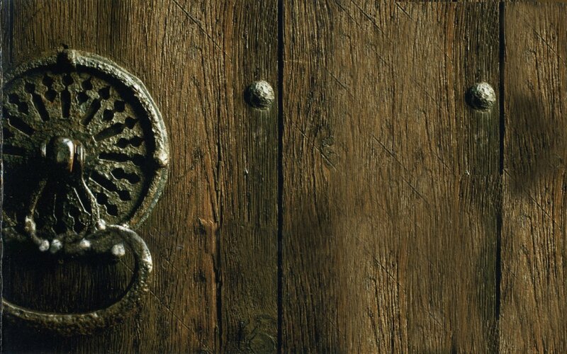 old wooden door with metal knocker