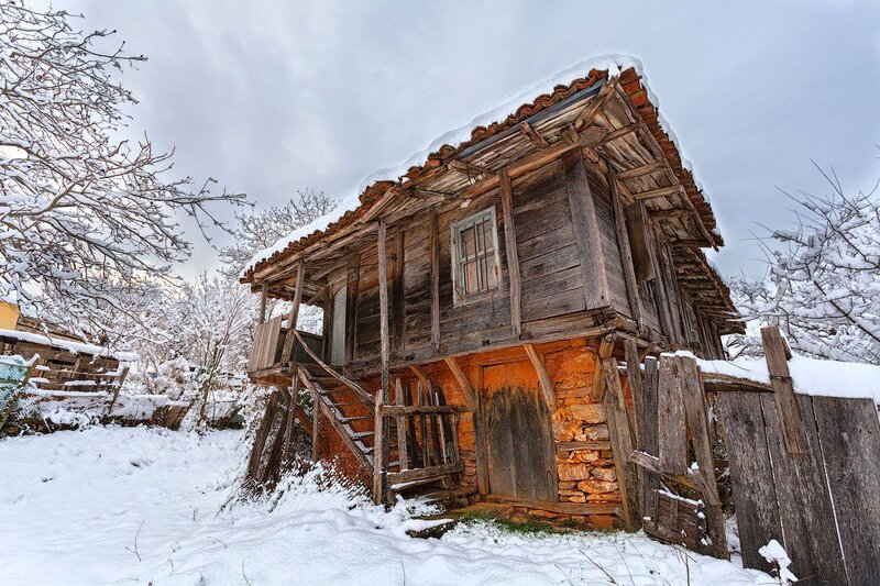 Old Wooden House in Snow