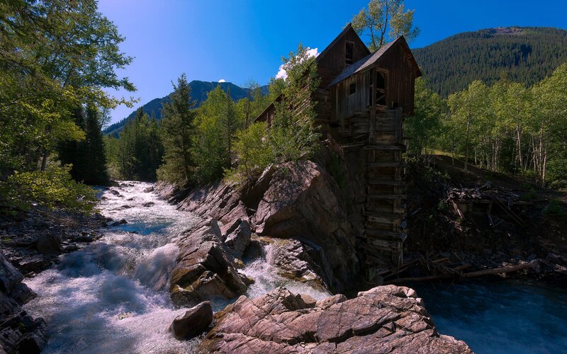 Old Wooden Mill by River
