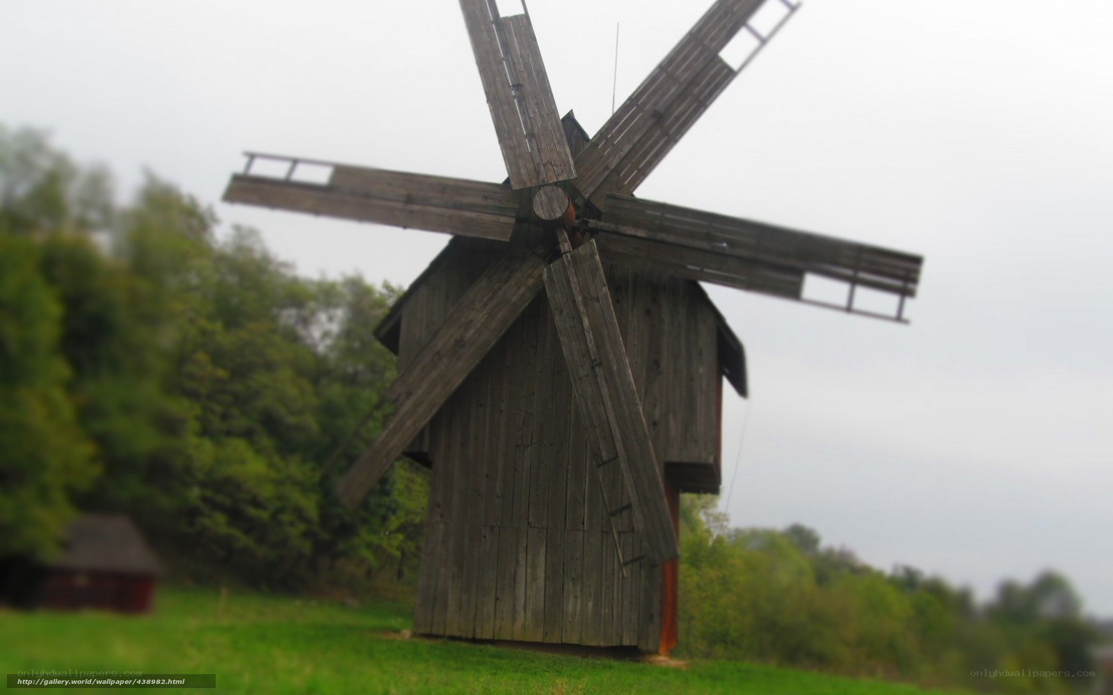 Old wooden windmill in field