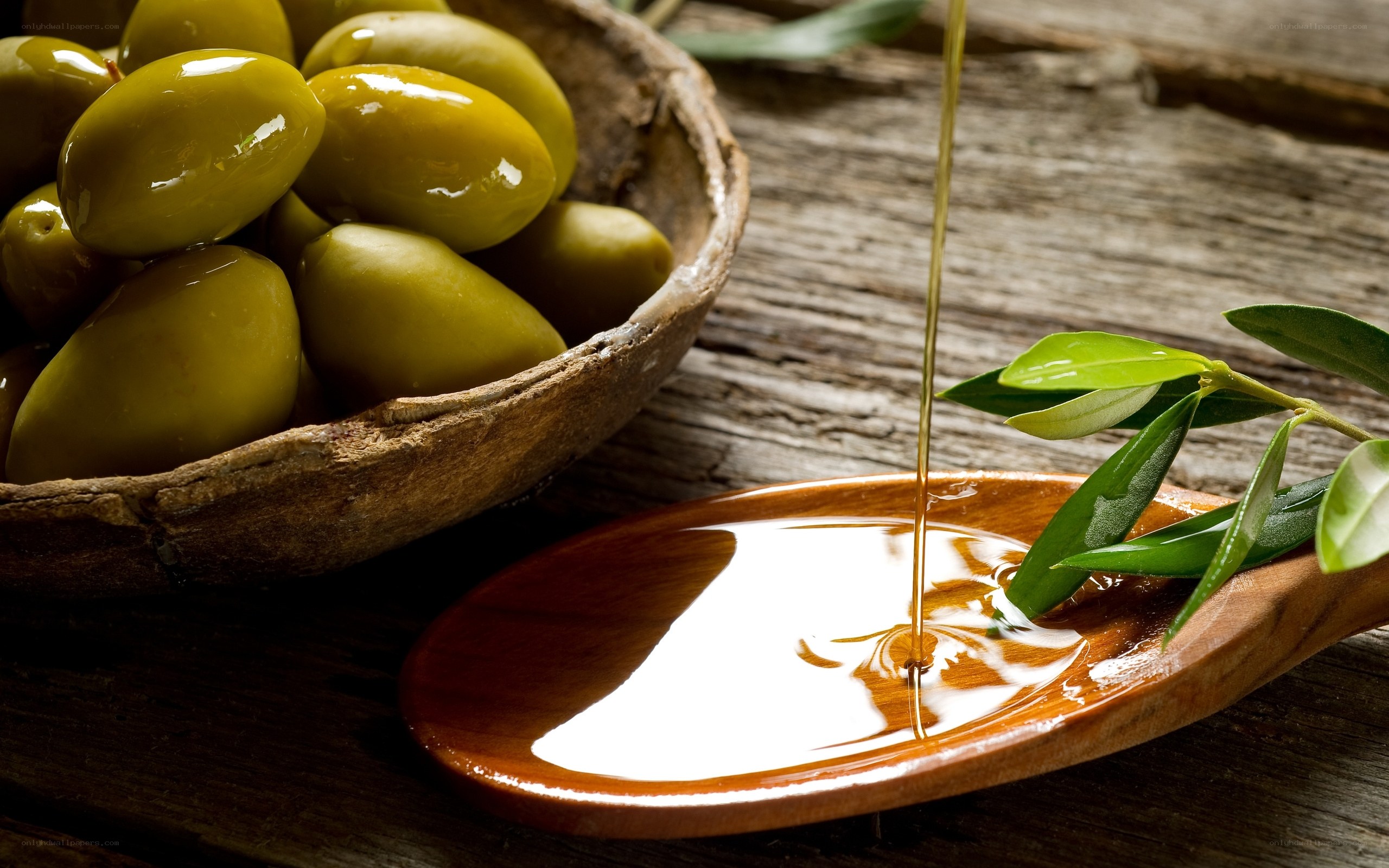 olive oil pouring into bowl