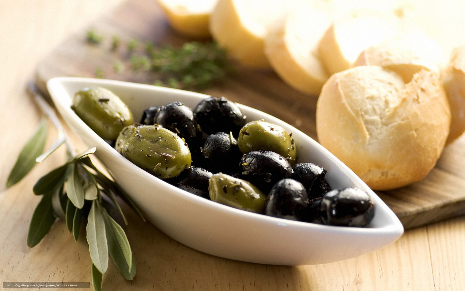 olives and bread on a board