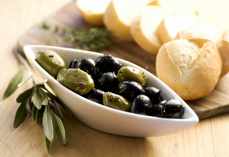 Olives and bread on a table