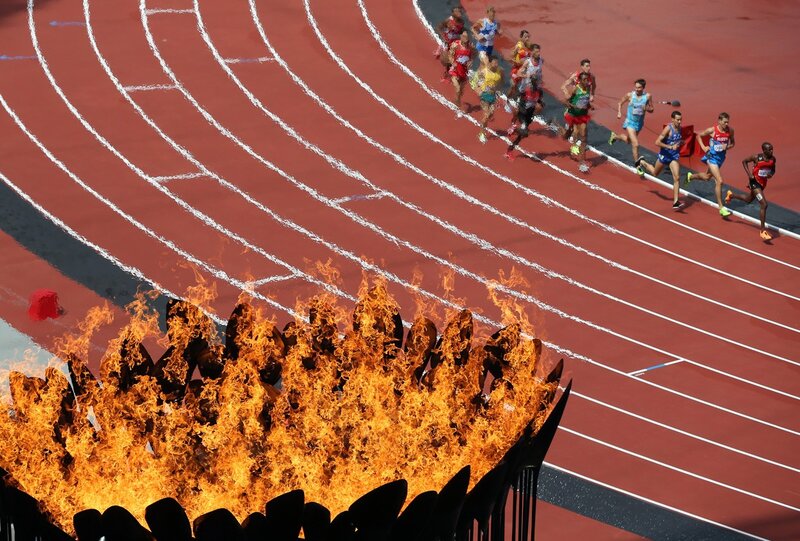 Olympic flame and runners