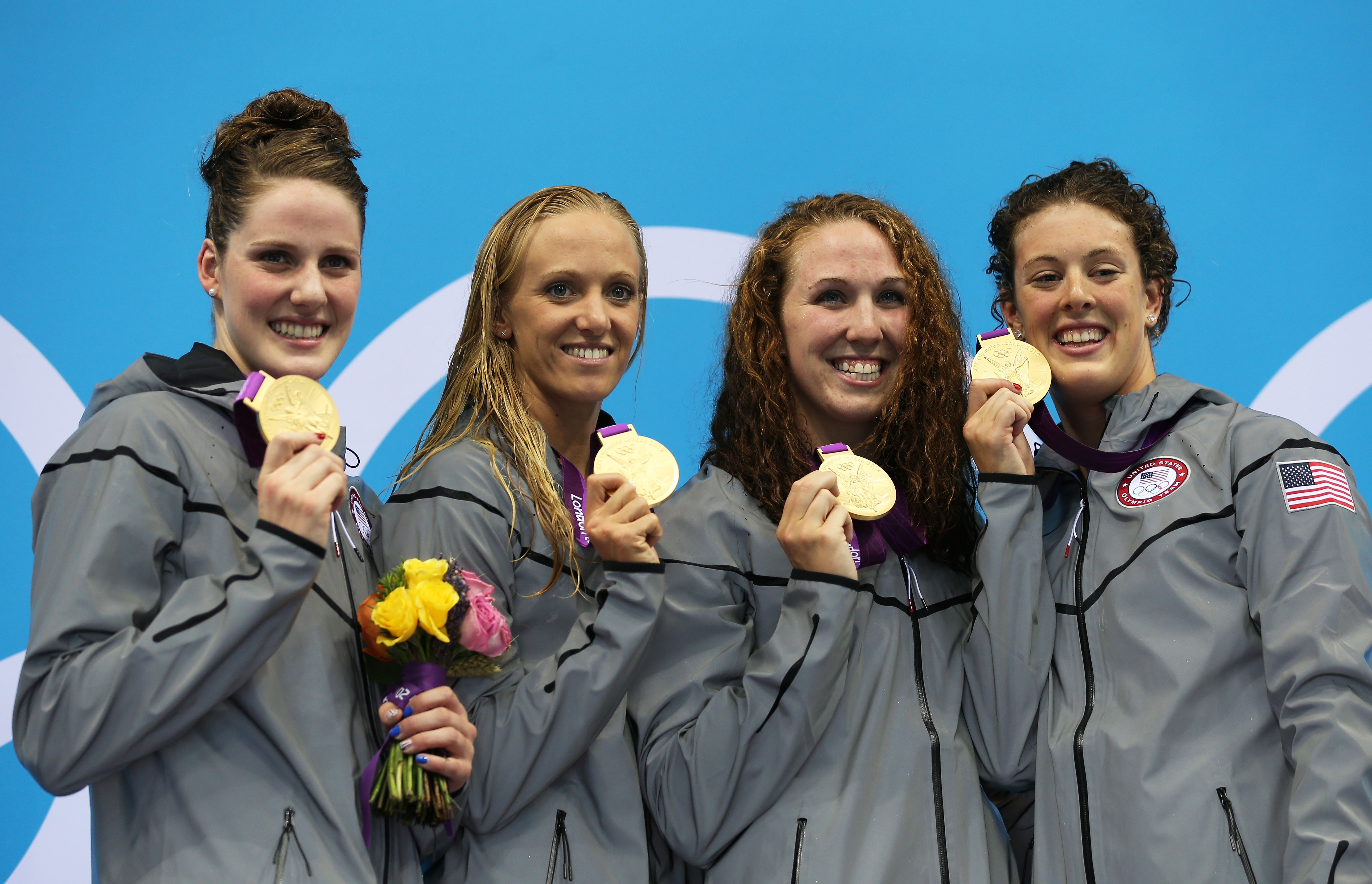 Olympic gold medalists posing