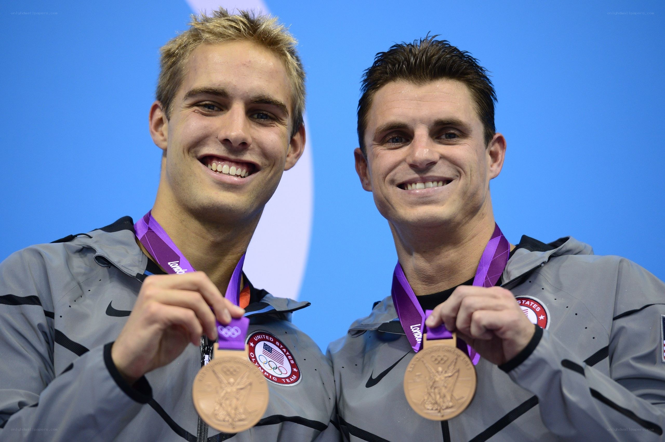Olympic medalists smiling