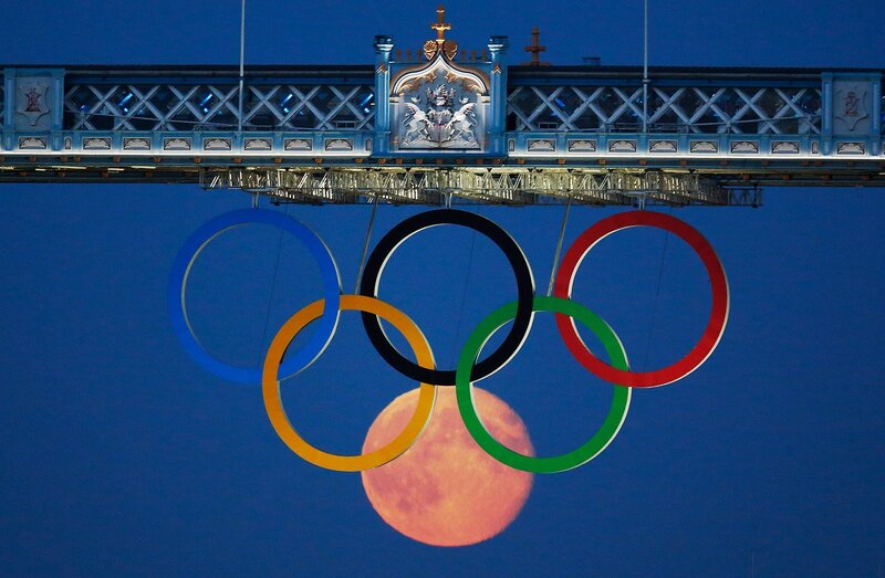 Olympic rings over moon