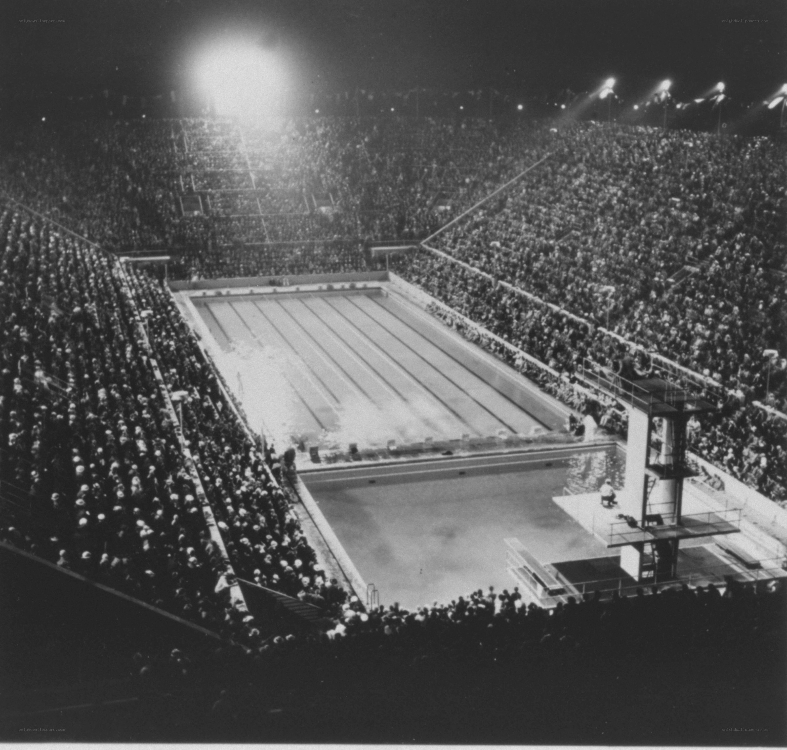 Olympic swimming stadium at night