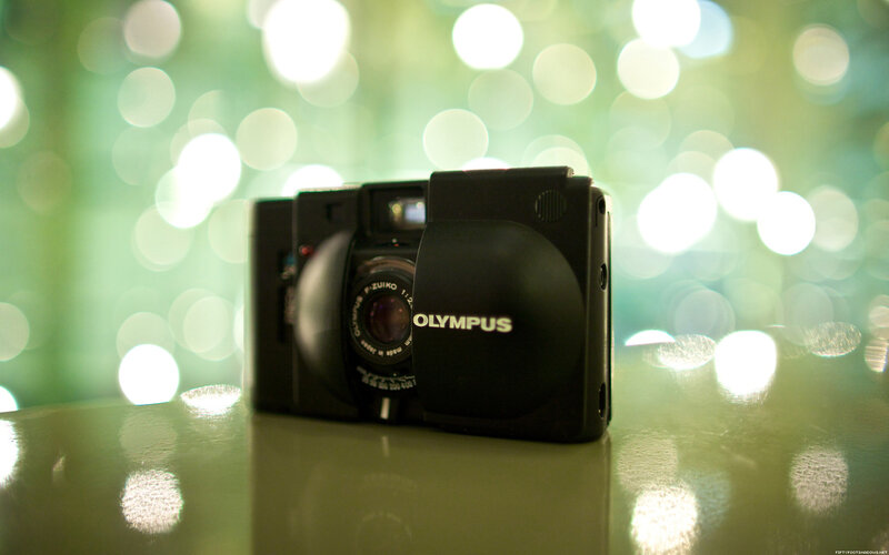 Olympus camera on reflective surface