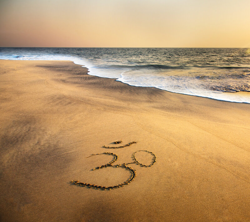 Om Symbol on Beach — Gold