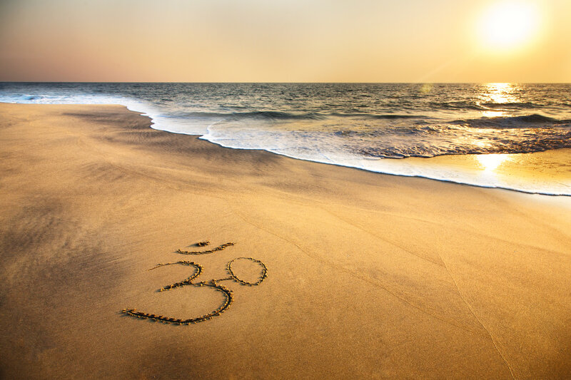 Om Symbol on Beach