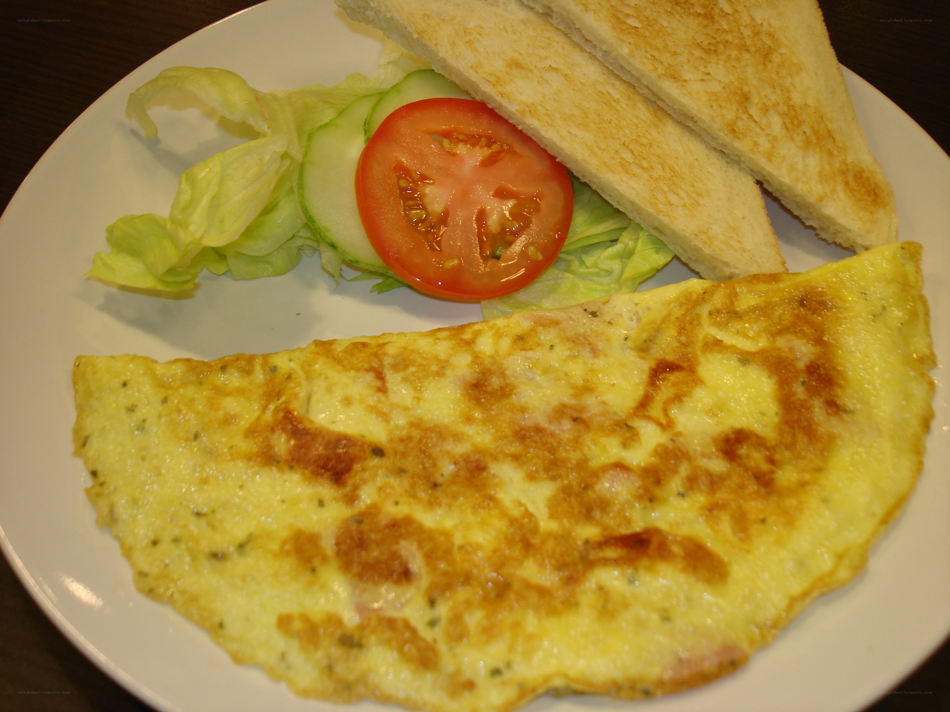 omelet with toast and salad